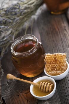 Jar of honey with honeycomb