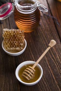 Jar of honey with honeycomb