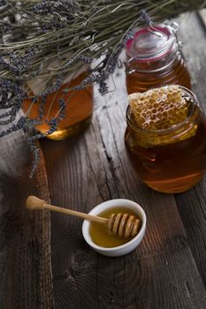 Jar of honey with honeycomb