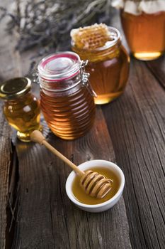 Jar of honey with honeycomb