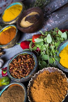 Variety of spices and herbs on kitchen table