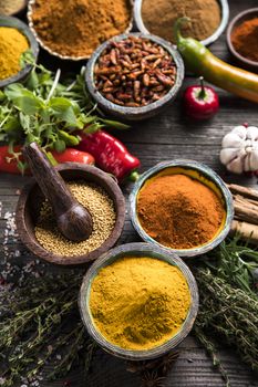 Variety of spices and herbs on kitchen table