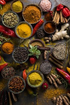 Variety of spices and herbs on kitchen table