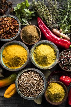 Spices over wooden background