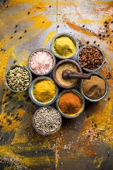 Spices on wooden bowl background