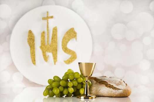 Holy communion a golden chalice, composition isolated on white