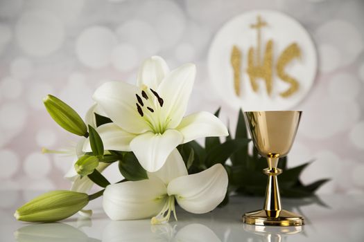 Holy communion a golden chalice with grapes and bread wafers