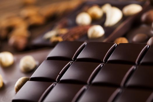 Dark and milk chocolate bar on a wooden table