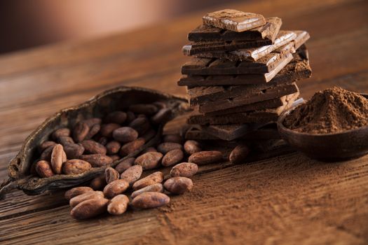 Dark and milk chocolate bar on a wooden table