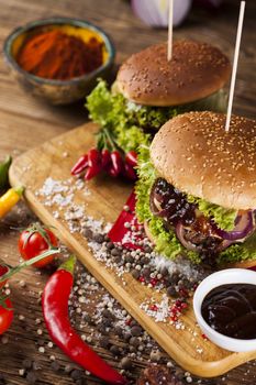 Fast food hamburge, wooden desk background