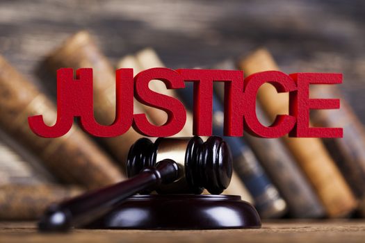 Judges wooden gavel, on wooden table background