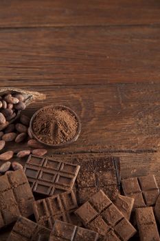 Dark and milk chocolate bar on a wooden table