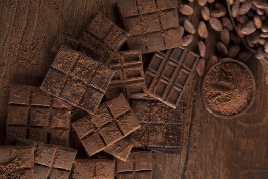 Dark and milk chocolate bar on a wooden table