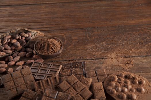 Dark and milk chocolate bar on a wooden table