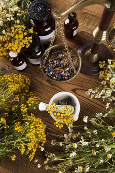 Herbal medicine on wooden desk background