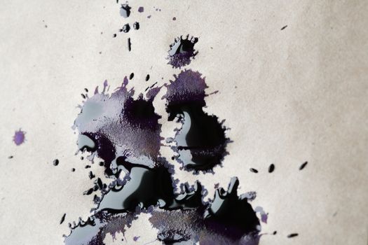 Inkblot closeup on old paper background