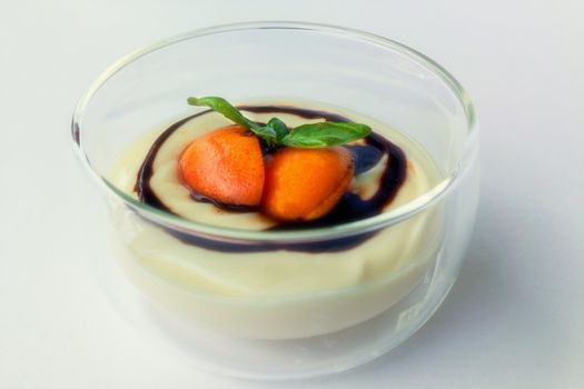 Dessert in glass bowl filled with a fruity pudding.