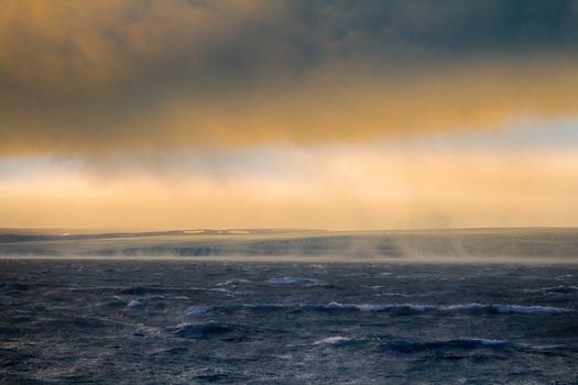 Hurricane (Bora) in Arctic Kara sea on Novaya Zemlya archipelago. Cold wind flows down from glacier with great speed (58 meters per second)