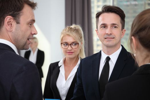 Group of caucasian business people talking in office