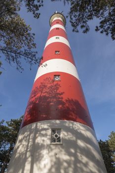 Lighthouse of the island Ameland in northern Netherlands as wide-angle shot
