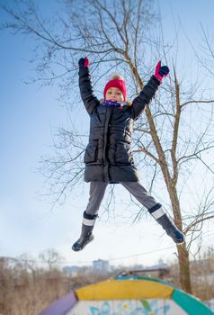 Girl jumping in winter