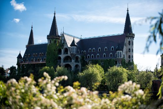 Beautiful old fairy-tale castle near Burgas, Bulgaria. Walls of the castle and flower garden