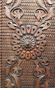 Detail from an old iron metal door. Close - up of ornament. Texture, background