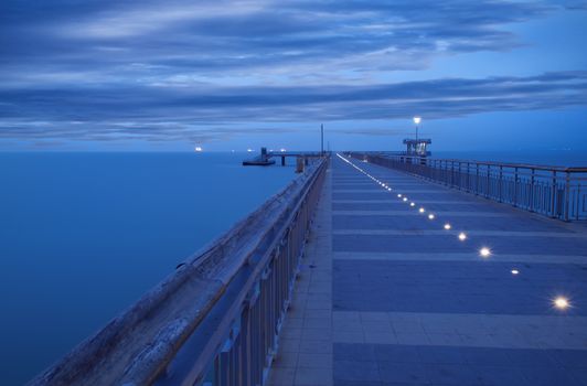 Before sunrise in Burgas bay. Bridge in Burgas, Bulgaria. Long exposure, blue hour. Kay port