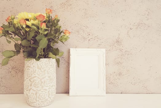 White Frame Mock Up, Digital MockUp, Display Mockup, Styled Stock Photography Mockup, Colorful Desktop Mock Up. Rustic vase with orange roses and yellow chrysanthemums. White background, empty place, copy space. Vintage tinted