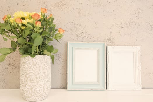 White and Blue Frame Mock Ups, Two Digital MockUp, Display Mockup, Sea Styled Stock Photography Mockup, Colorful Desktop Mock Up. Rustic vase with orange roses and yellow chrysanthemums. White background, empty place, copy space. Vintage tinted