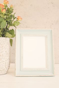 Blue Frame Mock Up, Digital MockUp, Display Mockup, Sea Styled Stock Photography Mockup, Colorful Desktop Mock Up. Rustic vase with orange roses and yellow chrysanthemums. White background, empty place, copy space. Vintage tinted