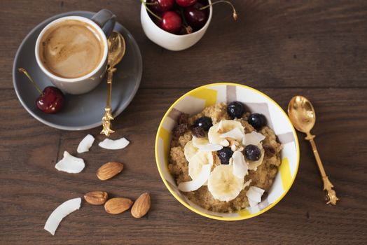 Almond Milk Quinoa With Fresh Fruits, Cherries And Coffee. Healthy Breakfast, Lifestyle Concept. Top View. Dark Wooden Background. Fitness Mood Diet. Summer Light Snack