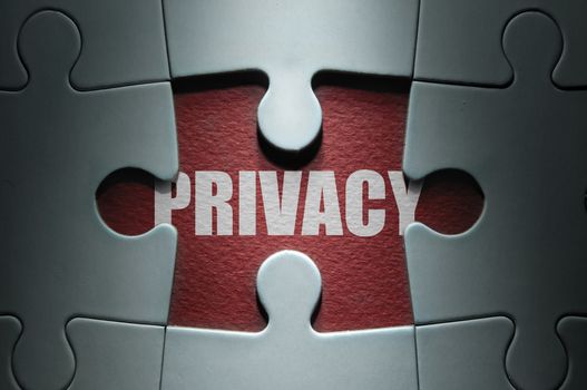 Missing piece from a jigsaw puzzle revealing the word privacy