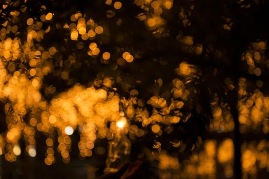 Close up of large golden bokeh shapes.