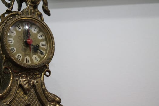 Antique carved metal table clock