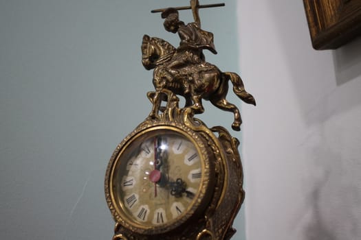 Antique carved metal table clock