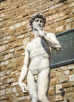 Replica of David statue of Michelangelo in front of Florence Palazzo Vecchio in Florence, Italy. Architecture and landmark of Florence