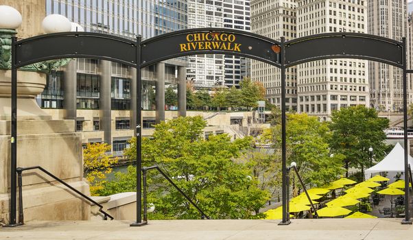 Metal sign indicating the entrance to the Chicago river walk