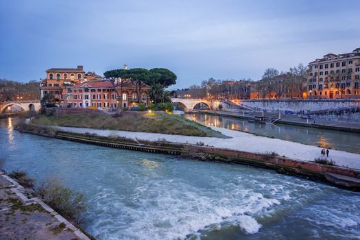 The historical Tiber island from the Garibaldi Bridge in Rome.