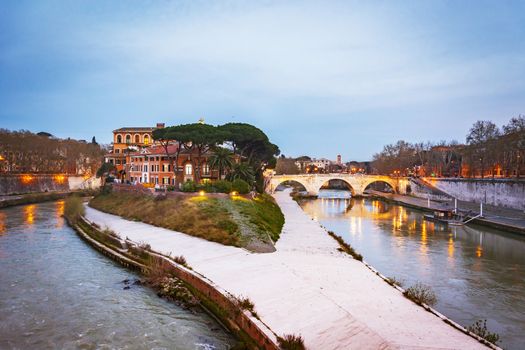 The historical Tiber island from the Garibaldi Bridge in Rome.