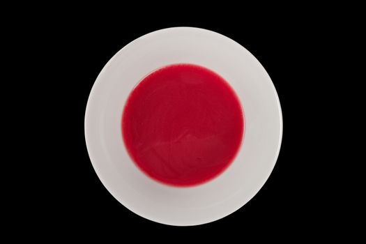 Beet soup with wine on a black background