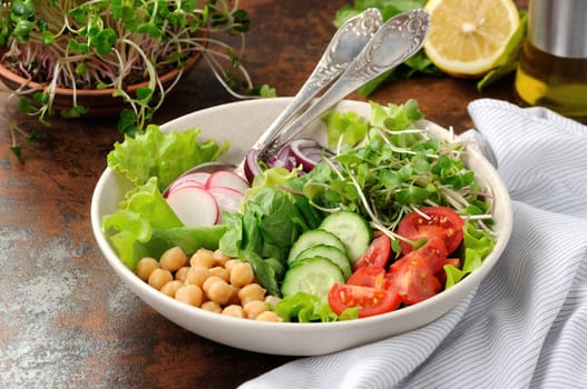 A beautiful Mediterranean salad of delicate leaves of lettuce and spinach, with the addition of Nuta, slices of fresh radish, tomato, cucumber and microsegment of radish. This is the perfect dish for those who are watching their health.