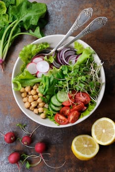 A beautiful Mediterranean salad of delicate leaves of lettuce and spinach, with the addition of Nuta, slices of fresh radish, tomato, cucumber and microsegment of radish. This is the perfect dish for those who are watching their health.
