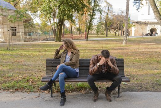 Attractive and handsome lovers trying to get over relationship crisis in the city park.