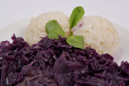 Tempeh with red cabbage and sorghum on a white background