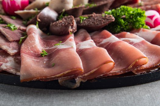 Assortment of meat delicatessen on a plate