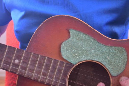 Man playing acoustic guitar. Musical concept. Close-up