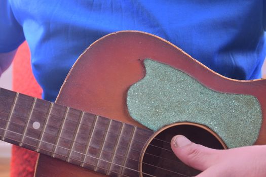 Man playing acoustic guitar. Musical concept. Close-up