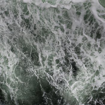 Big water splash seen from above a boat