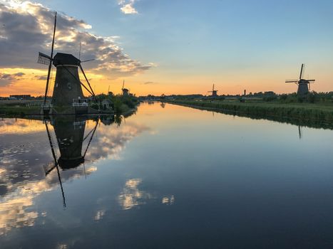 Beautiful dutch windmill landscape at the famous Kinderdijk canals, UNESCO world heritage site